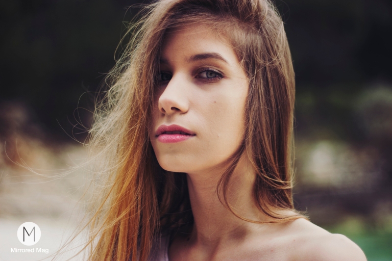 model with long hair on a cloudy day